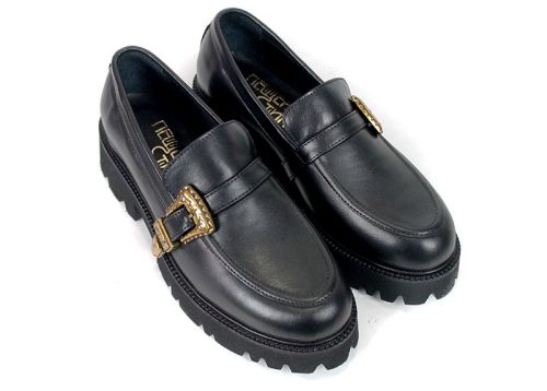 Women's black genuine leather shoes with gold-tone decorative buckle.